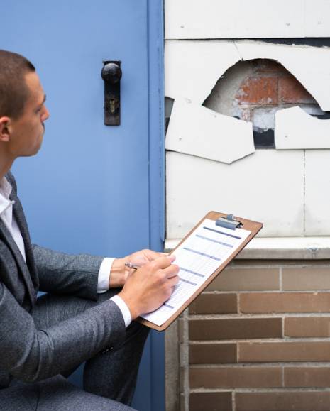Real Estate Property Appraisal. Man Inspecting House